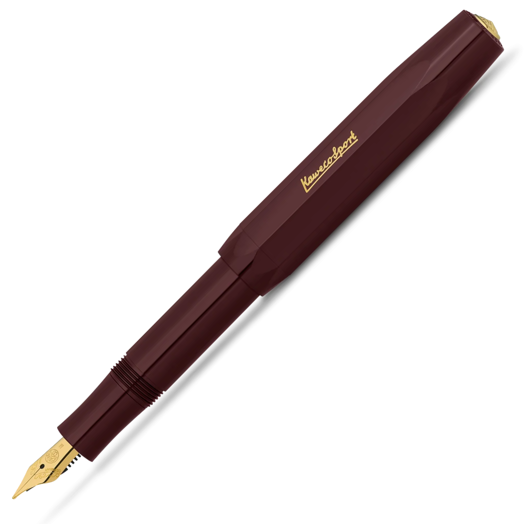 A Kuvings fountain pen in a deep burgundy barrel with gold accents, including the brand name 'Kuvings' on the cap and the nib. The pen is shown diagonally on a clean white background.