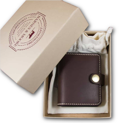 Barnes and Moore dark leather sportsman wallet fastened with a tab and solid brass snap and has outer stitching in a box and fabric bag sold at regent in salisbury