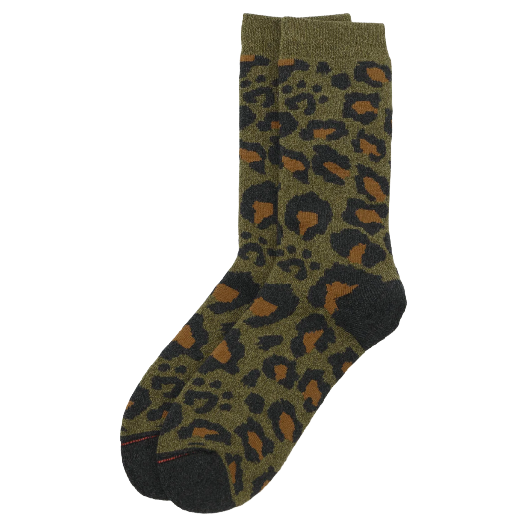 A pair of crew socks with an olive green base featuring a leopard print pattern in black and brown, with solid dark green heels, toes, and cuffs.