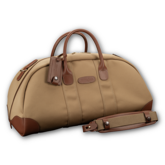 Beige duffel bag with brown handles and strap on a white background