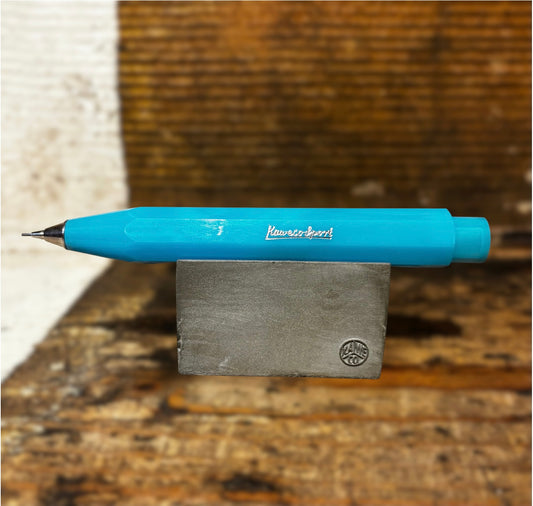 Light Blue Kaweco Pen on wooden block on wooden background Men's accessories