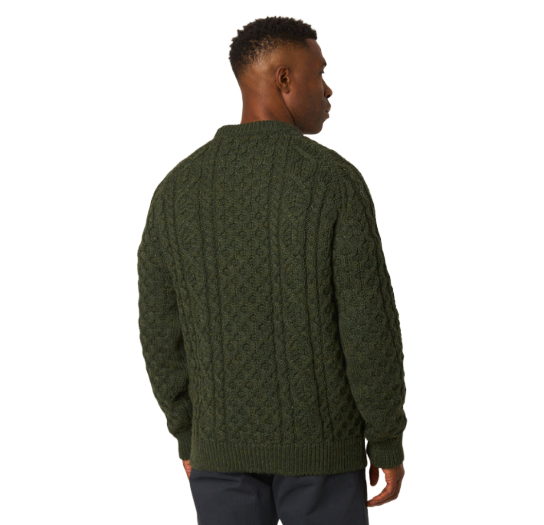 A man wearing an olive green cable-knit sweater, shown from the back against a plain white background.
