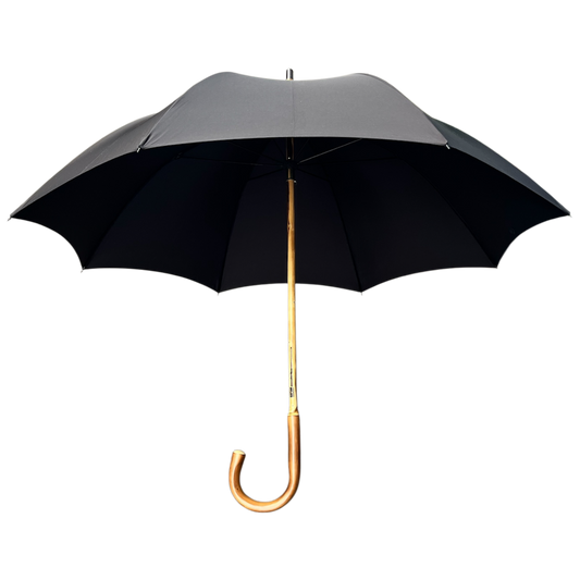 A black open umbrella with a gold-colored curved handle and shaft, shown against a plain white background.