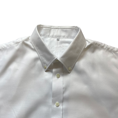 A close-up of a white long-sleeve button-down shirt with a classic collar and light-colored buttons, laid flat against a white background.