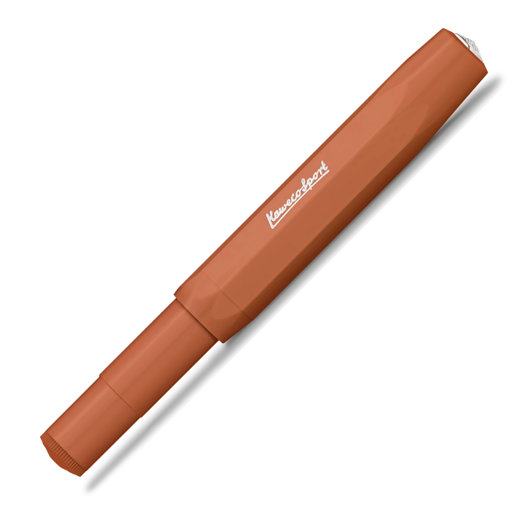 A single orange pen with a faceted barrel design and a white logo printed on the side, shown diagonally on a white background with a soft drop shadow.