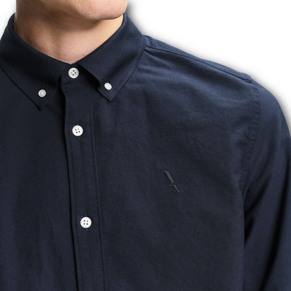 Close up of the collar of navy Aigle dry fast Oxford shirt sold at Regent