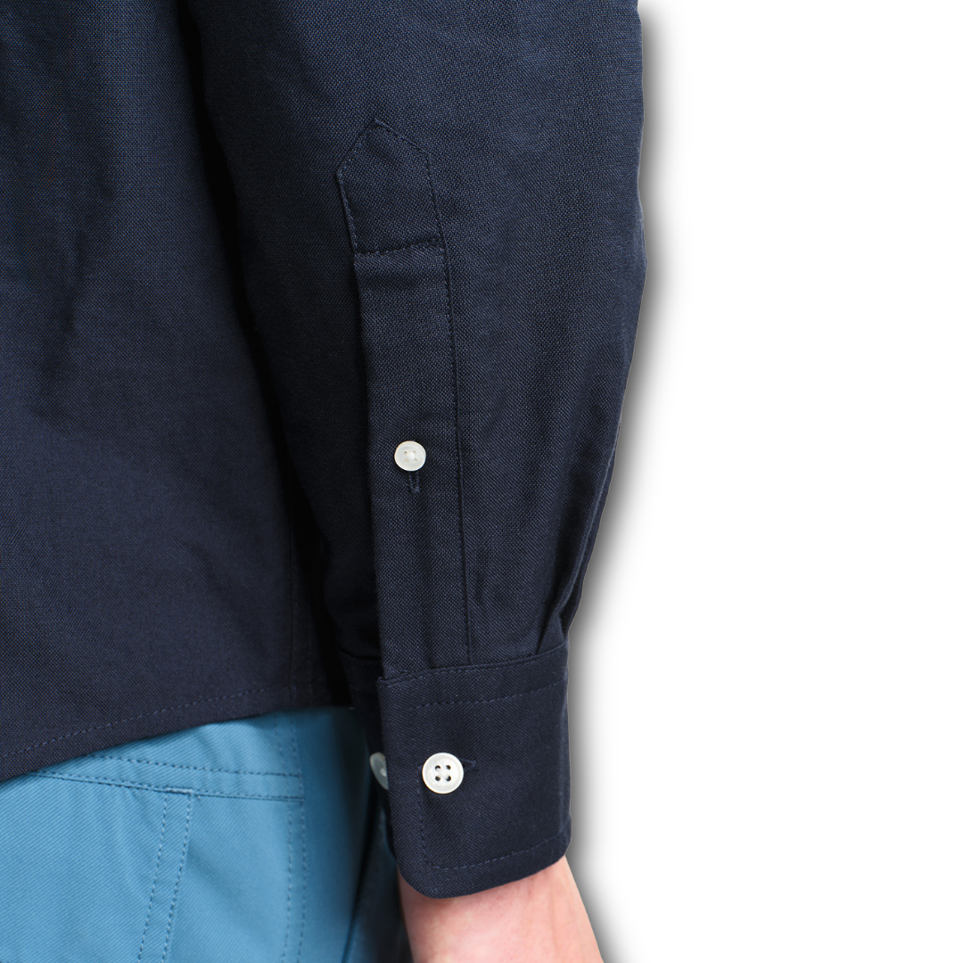 Close up of sleeve of navy Aigle oxford shirt sold at Regent in Salisbury