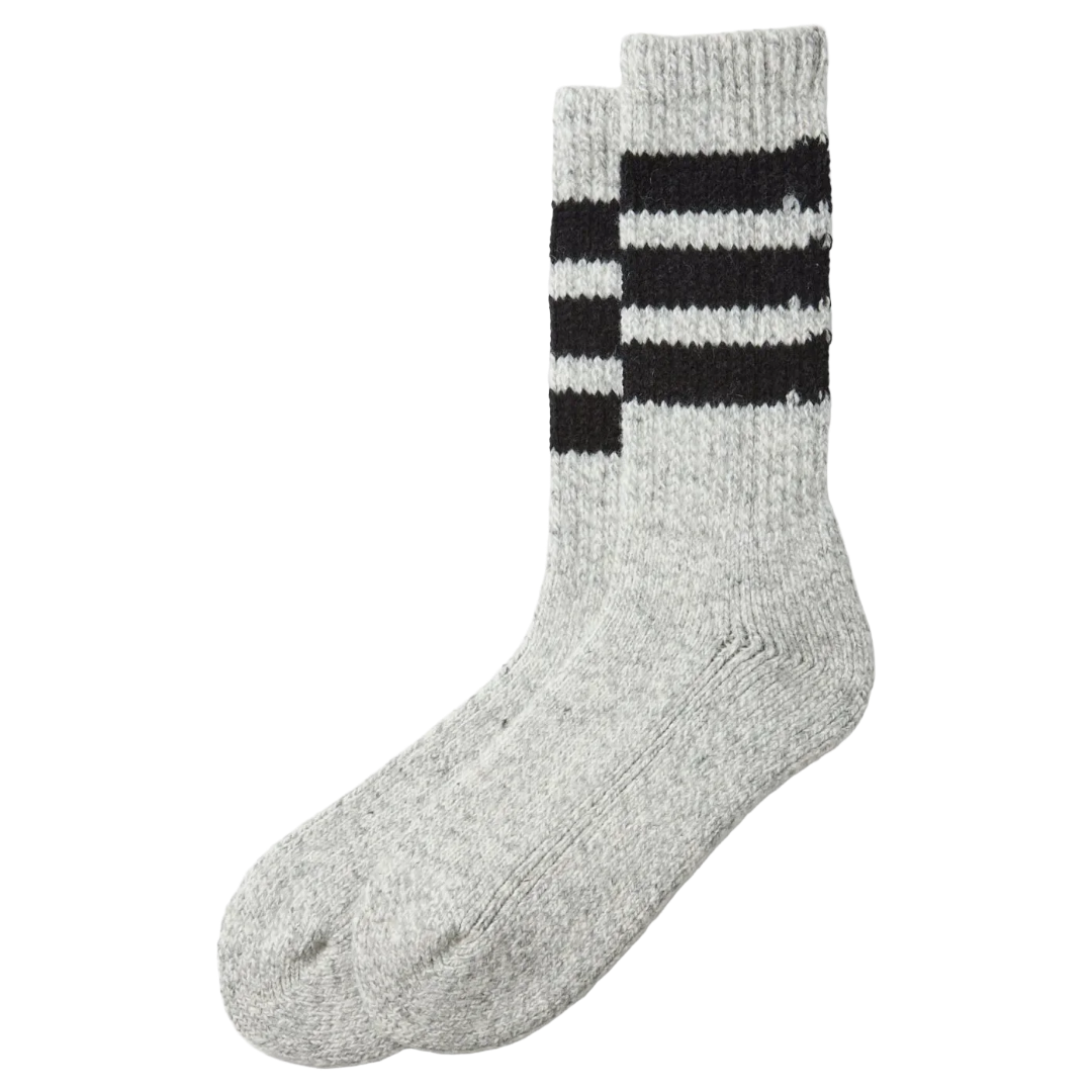 A pair of light heather gray knit crew socks with three black stripes on the upper leg, displayed against a solid white background.