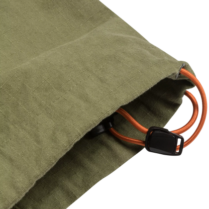 Close-up of an olive green canvas drawstring bag with an orange elastic cord and a black plastic toggle clasp, shown on a white background.