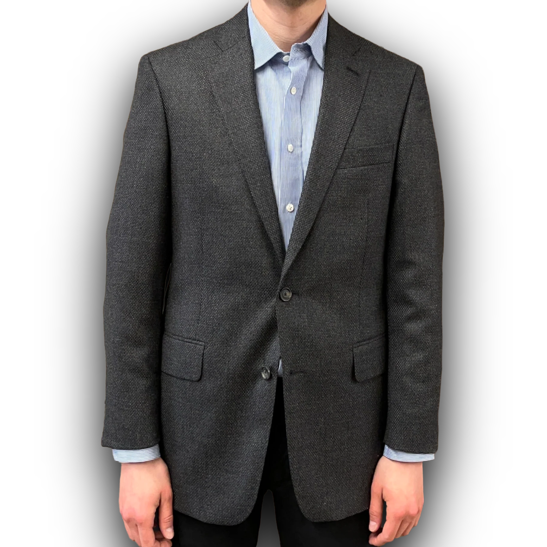 Gray blazer worn by a person on a white background
