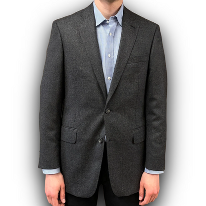 Gray blazer worn by a person on a white background