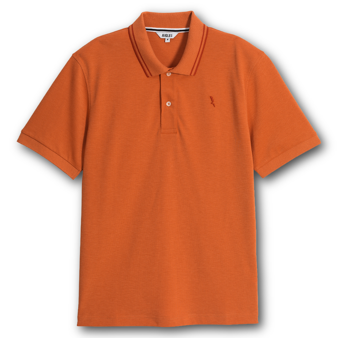 Aigle orange dry fast polo shirt with a small logo on a white background sold at Regent in Salisbury