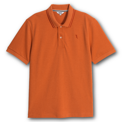 Aigle orange dry fast polo shirt with a small logo on a white background sold at Regent in Salisbury