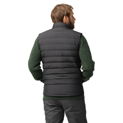 A man shown from the back wearing a dark gray quilted puffer vest over a dark green knit sweater and gray pants, against a plain white background.