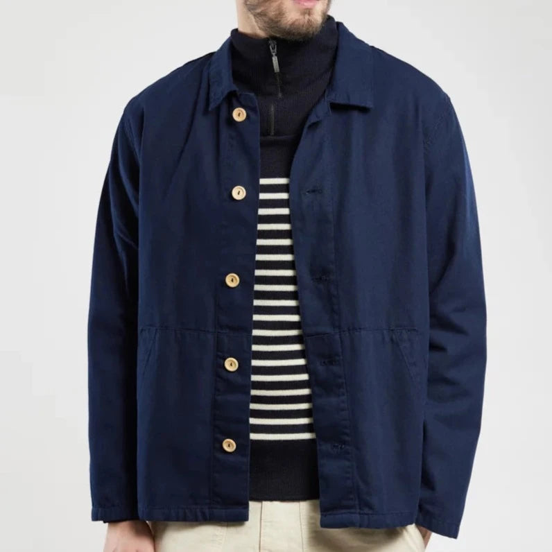 A classic fisherman's style chore jacket in a deep marine blue with contrasting wooden buttons.