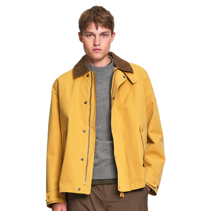 Aigle Water-Repellent Field Jacket in Honey with a contrasting corduroy collar, relaxed fit, lightweight lining and practical pocket detailing.