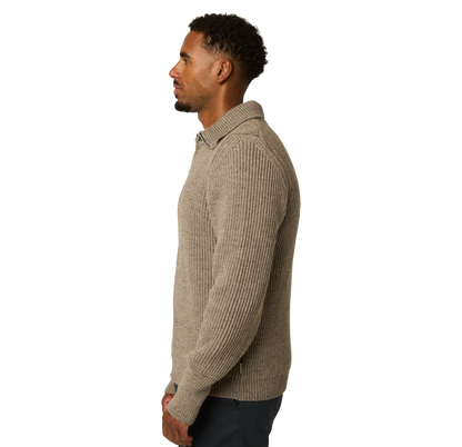 A man shown in side profile wearing a ribbed knit long-sleeve polo-style sweater in a taupe-beige color, paired with dark pants, against a plain white background.