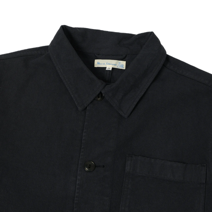 Close-up of a charcoal  cotton shirt jacket with a pointed collar, button front.