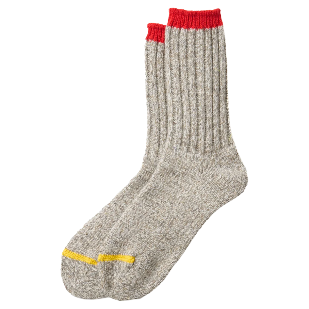 A pair of heather gray ribbed crew socks with a bright red cuff and a yellow stripe near the toe, shown against a plain white background.