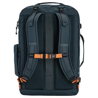 The back view of a dark navy blue backpack with orange accent buckles and straps, shown on a solid white background.