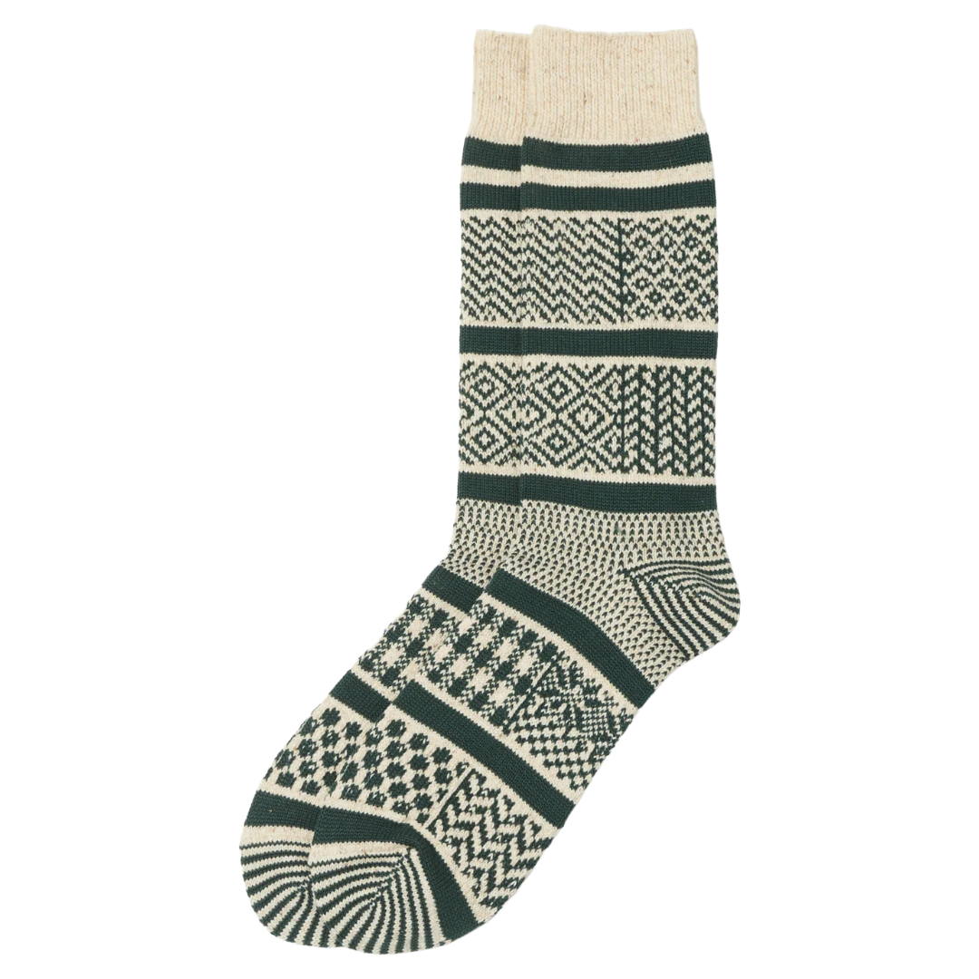 A pair of cream and dark green patterned knit socks with a ribbed cream cuff, displayed against a solid white background.