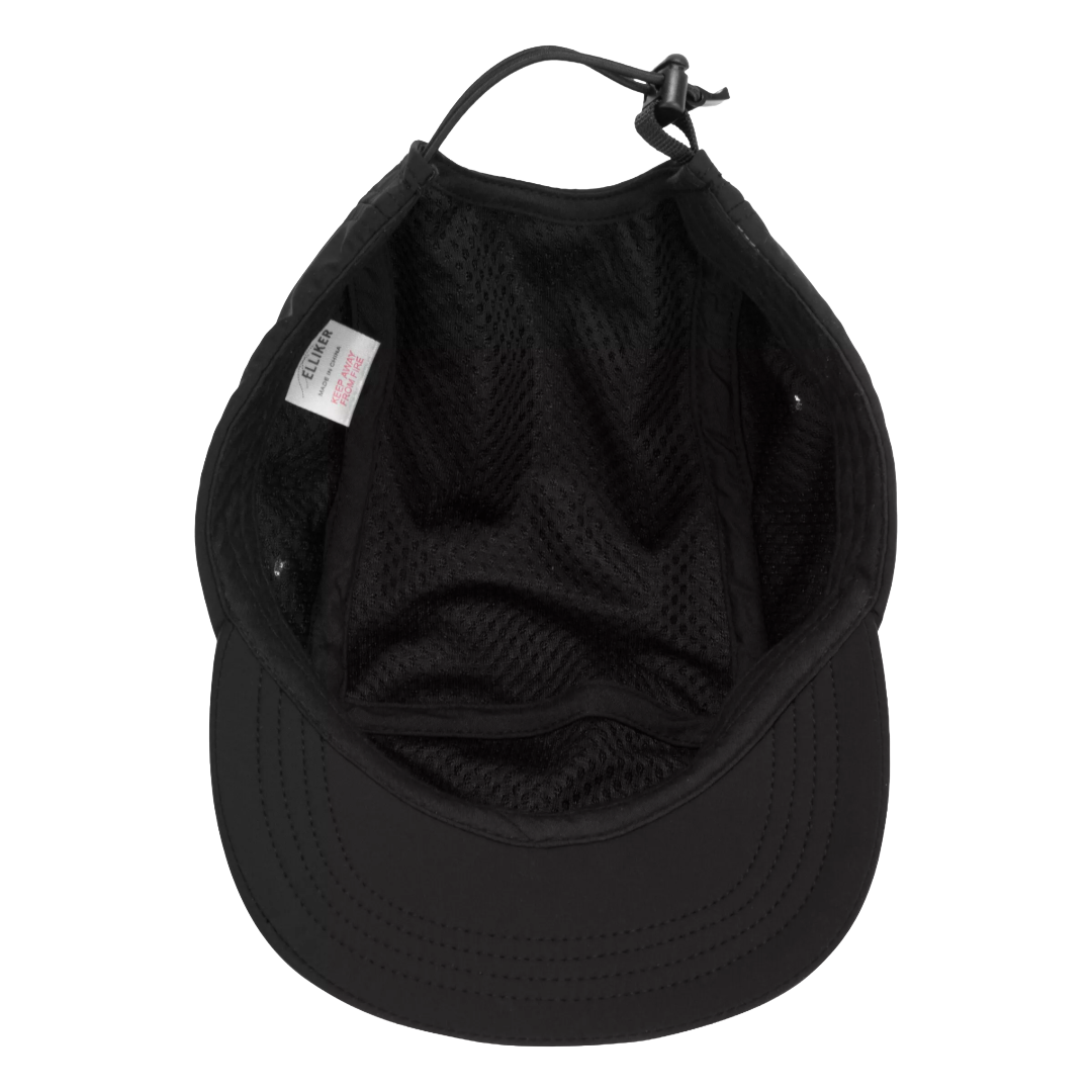 Black baseball cap viewed from the inside, showing the black mesh interior lining, adjustable strap, and a small white brand tag on the left side.