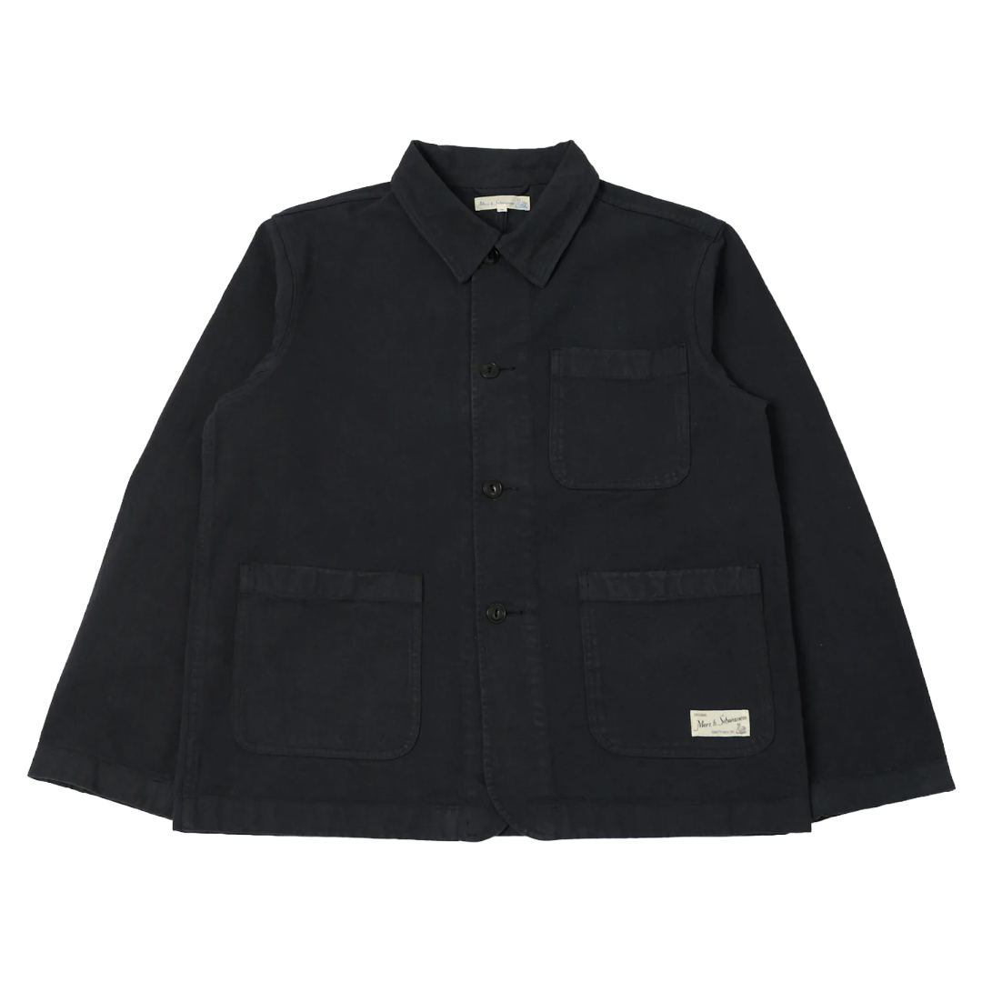 A charcoal canvas utility jacket with a pointed collar, button-up front, and four front patch pockets, laid flat against a white background.