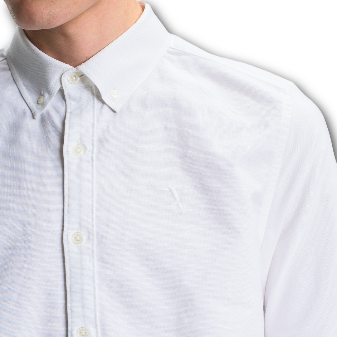 Close-up of Aigle white linen button-up shirt with a collar and buttons sold at Regent in Salisbury