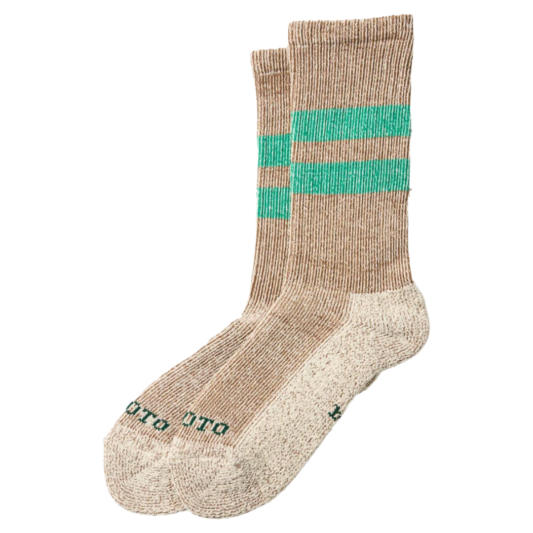 Three pairs of knit crew socks in a heathered tan color, featuring two horizontal mint green stripes near the cuff and the brand name 'OTTO' printed in green on the toes, set against a plain white background.