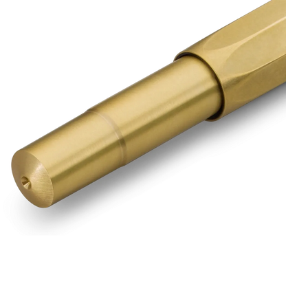 A close-up of a metallic gold pent with a hexagonal section, shown on a clean white background.