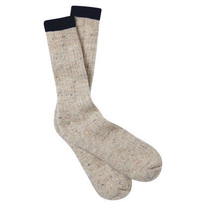 A pair of heathered beige crew socks with a dark navy ribbed cuff, displayed against a solid white background.