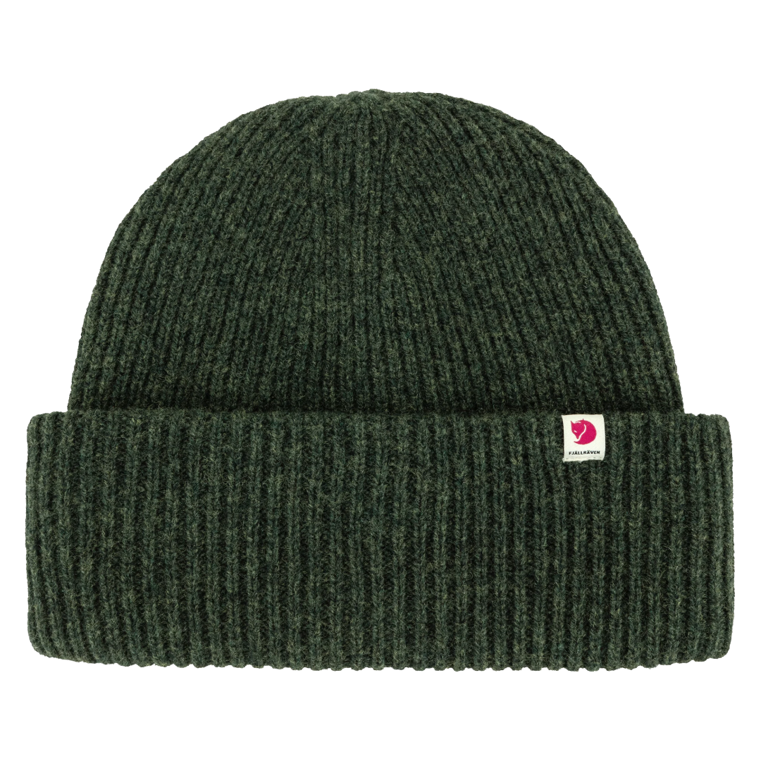 A dark forest green ribbed knit beanie hat with a small pink and white Fjälman logo patch on the front cuff, shown against a plain white background.