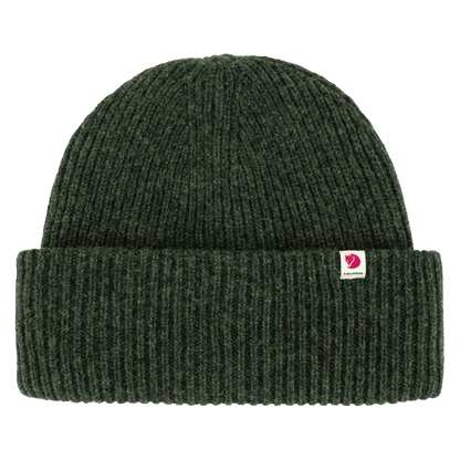 A dark forest green ribbed knit beanie hat with a small pink and white Fjälman logo patch on the front cuff, shown against a plain white background.