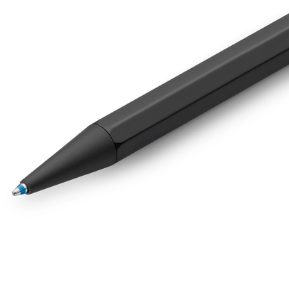 A close-up of a sleek black ballpoint pen with a metallic tip, shown diagonally on a clean white background.