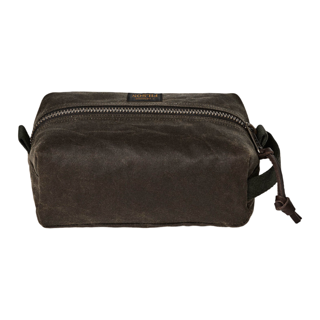 A dark brown waxed canvas pouch bag with a top zipper and a small leather brand tab, shown on a plain white background.