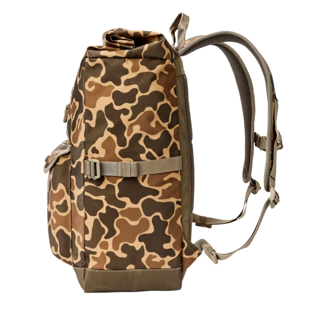 A tactical backpack with a brown, tan, and dark green camouflage pattern, featuring a top roll-top closure, a front utility pocket with a buckle strap, and padded shoulder straps, shown against a plain white background.