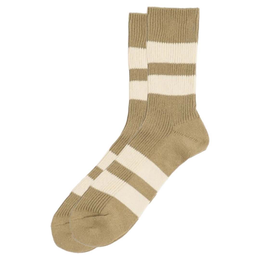 A pair of crew socks in a warm tan and cream color-blocked stripe pattern, shown against a plain white background.