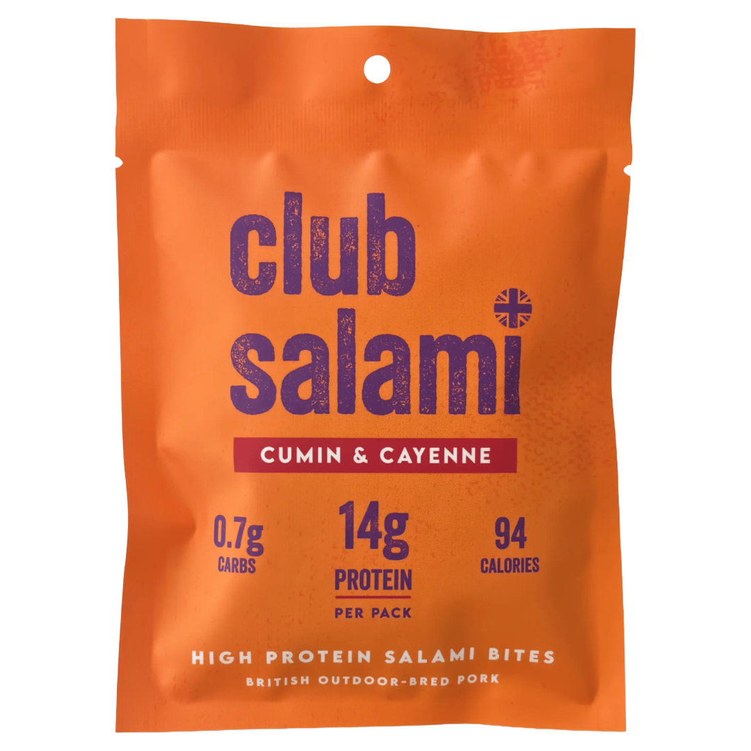 An orange stand-up pouch of Club Salami Cumin & Cayenne high protein salami bites, featuring dark purple text and a red banner with white text.