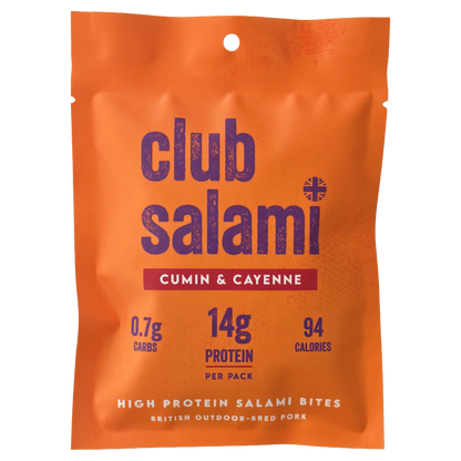 An orange stand-up pouch of Club Salami Cumin & Cayenne high protein salami bites, featuring dark purple text and a red banner with white text.