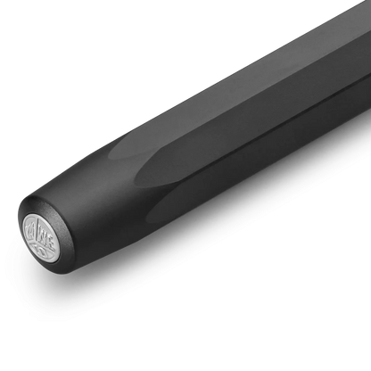 Close-up of a black cylindrical product, likely a handlebar grip or rod end, featuring a circular silver logo badge on the end cap, set against a clean white background.