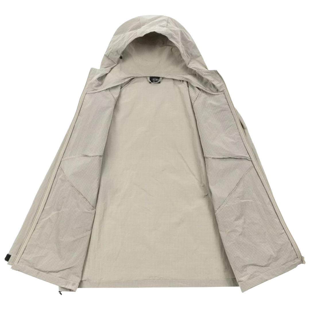 A light beige hooded jacket laid flat against a solid white background, showing its front zipper closure and textured fabric.