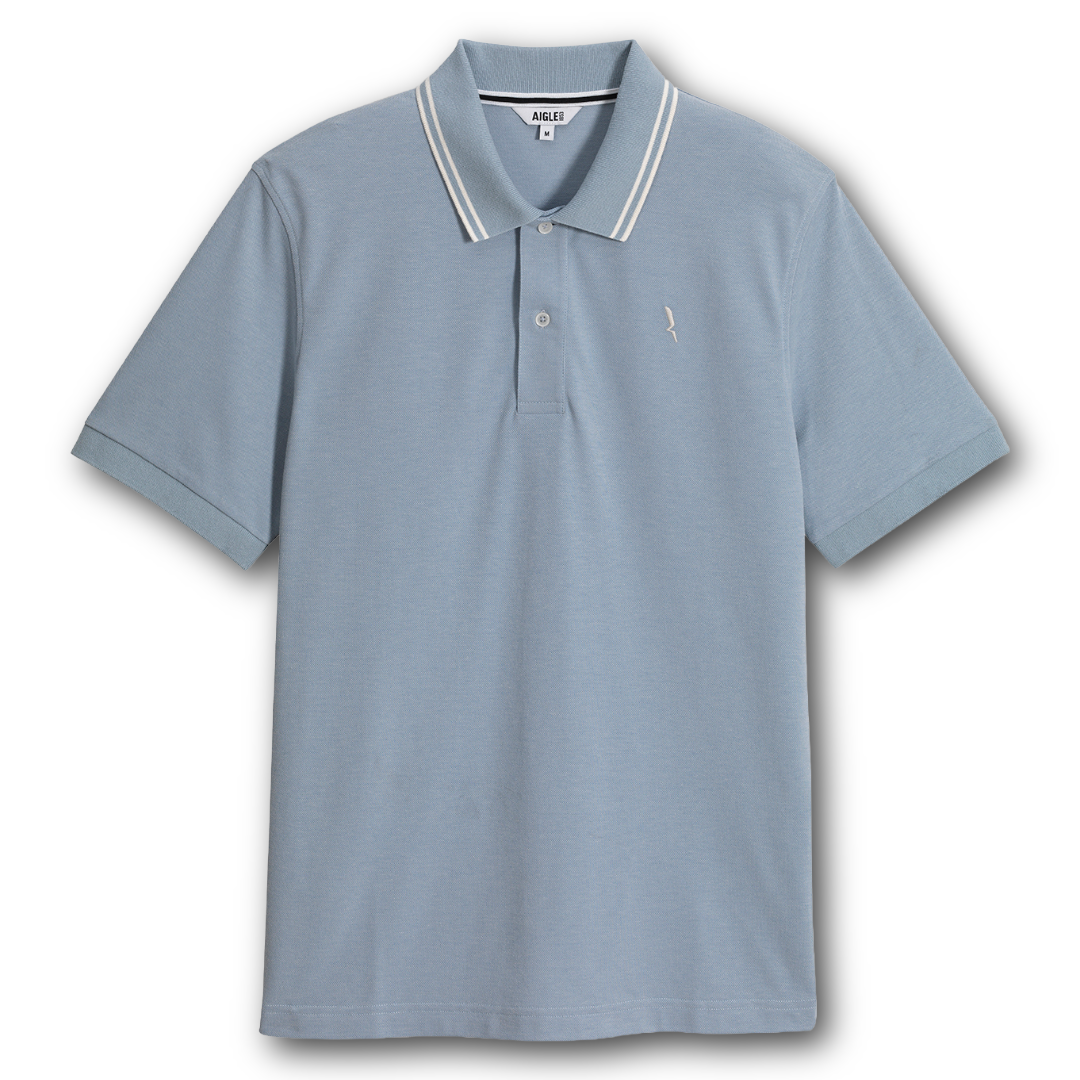 Aigle light blue dryfast polo shirt with white trim on a white background sold at Regent in Salisbury