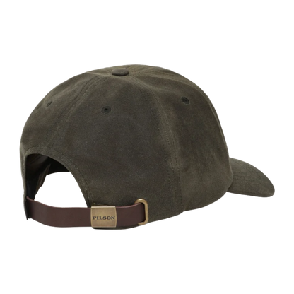 An olive green Filson baseball cap shown from a rear three-quarter angle, featuring a brown adjustable strap with a brass-tone metal buckle and a gold-toned metal brand plate.