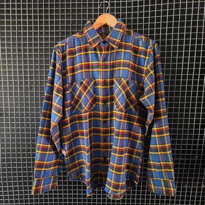 Plaid shirt hanging on a grid wall