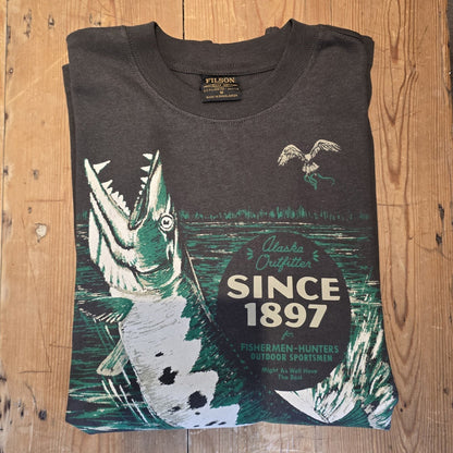 Dark gray t-shirt with graphic design and text on a wooden surface