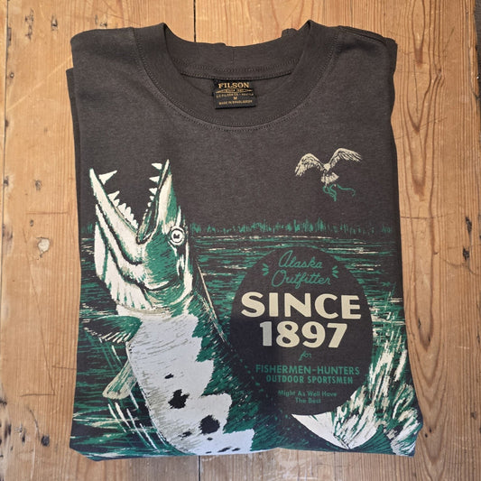 Dark gray t-shirt with graphic design and text on a wooden surface