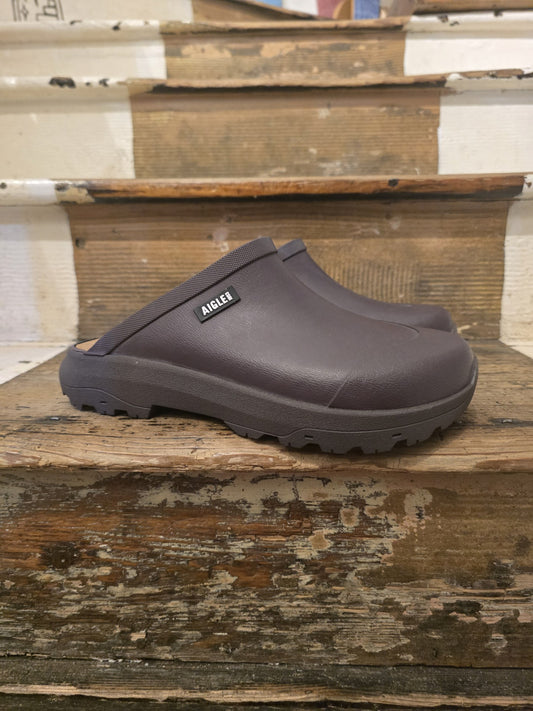 Brown clog shoe on a wooden surface