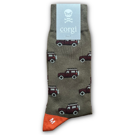 Green Sock with Land Rover  pattern and 'corgi' brand label on a white background. Sold in Salisbury by regent tailoring