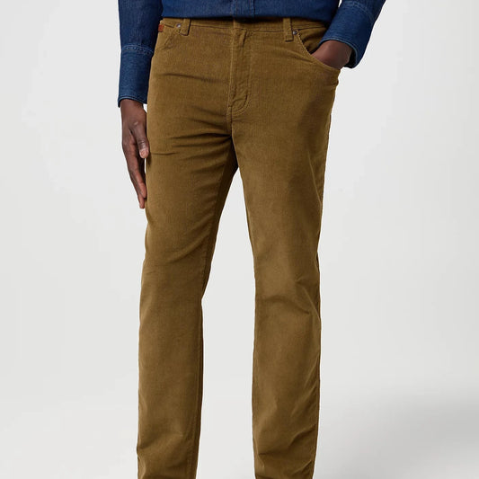 Person wearing brown pants and a blue shirt on a white background
