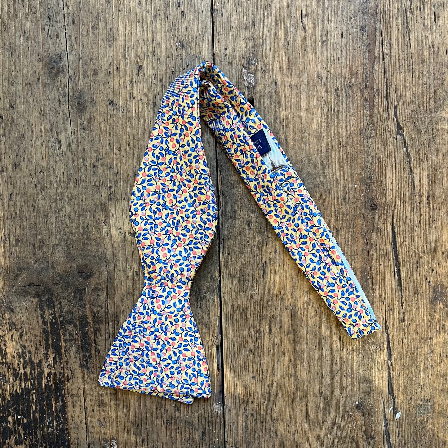 Floral Bowtie with Cape Gooseberries and Blueberry pattern, available at Regent Tailoring Salisbury 